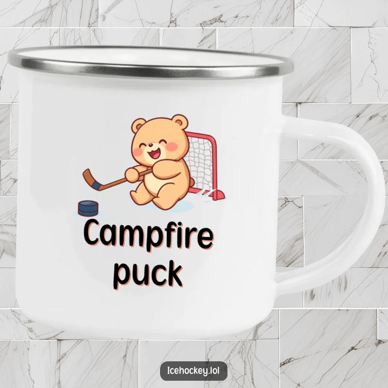 Funny camping mug with a joyful, round bear cub skillfully shooting a hockey puck, perfect for outdoor drinks with humor.