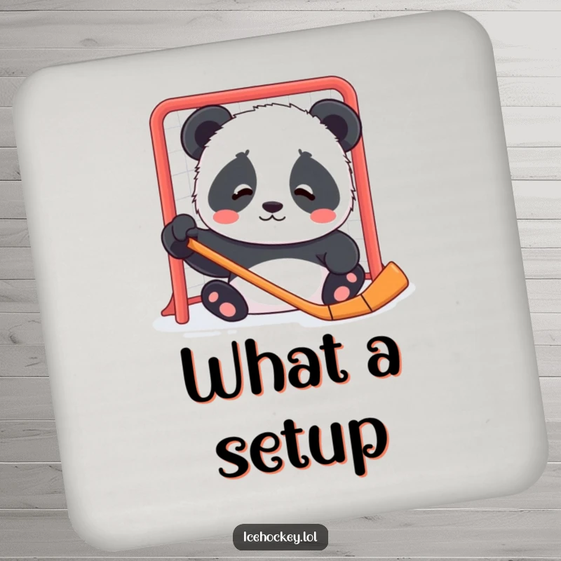 Funny drink coaster with a contented panda cub looking confused by a hockey net, bringing gentle humor to surfaces.