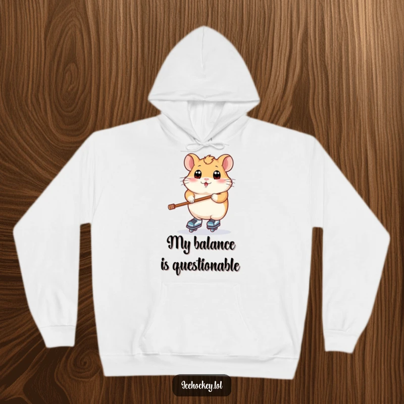 Funny hoodie showing a plump hamster with wide eyes trying to balance on ice skates while holding a hockey stick.