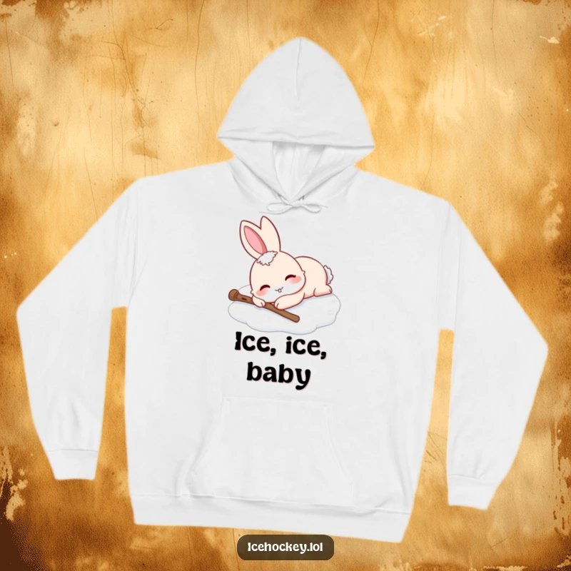 Funny hoodie with a smiling rabbit relaxing on the ice after a skating fall, stick on the side. Cozy humor.