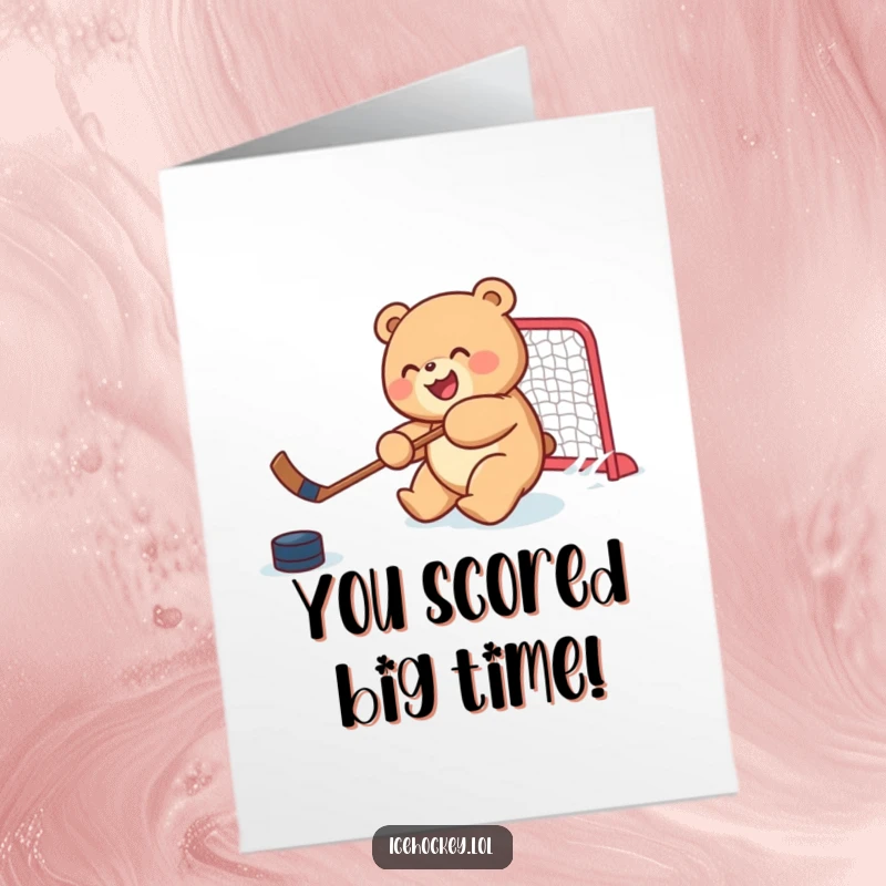 Funny Free Printable Congratulations Card: a round bear cub joyfully shooting a puck into a goal.