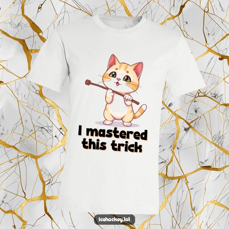 Funny cat t-shirt with a curious kitten fumbling a magic stick trick, capturing a moment of pure, comical bewilderment.