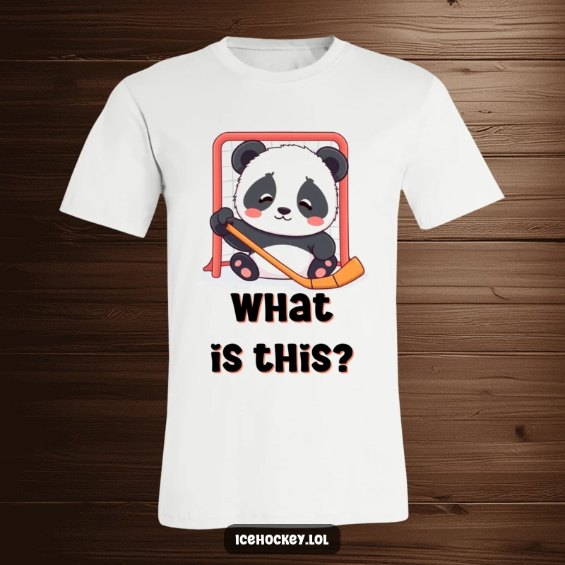 Funny t-shirt depicting a contented panda cub with a confused expression, looking at a hockey net.
