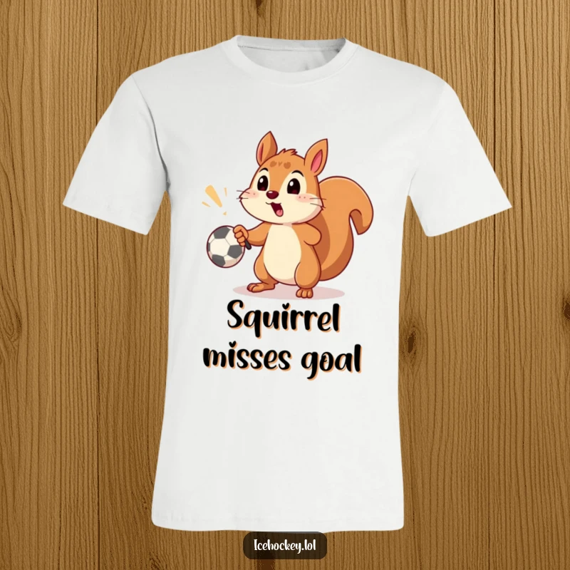 Funny t-shirt depicting a surprised squirrel narrowly missing a soccer goal with a well-aimed shot, full of playful energy.