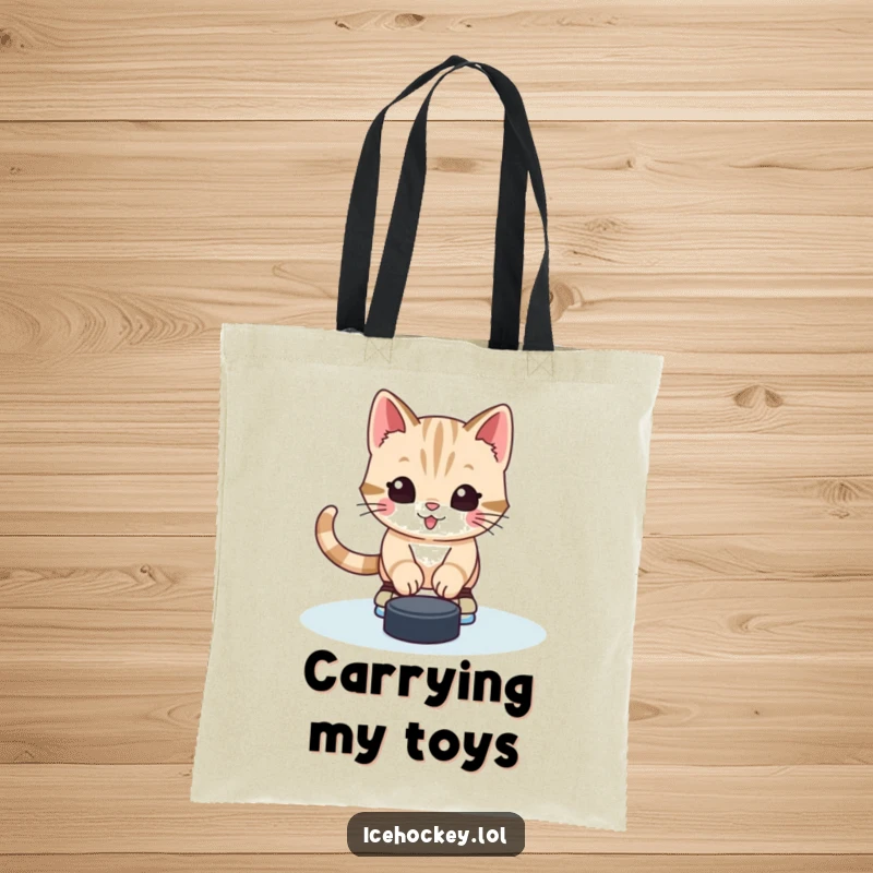 Funny tote bag featuring a cute and alert kitten dressed in skates, defending a hockey goal with humor.