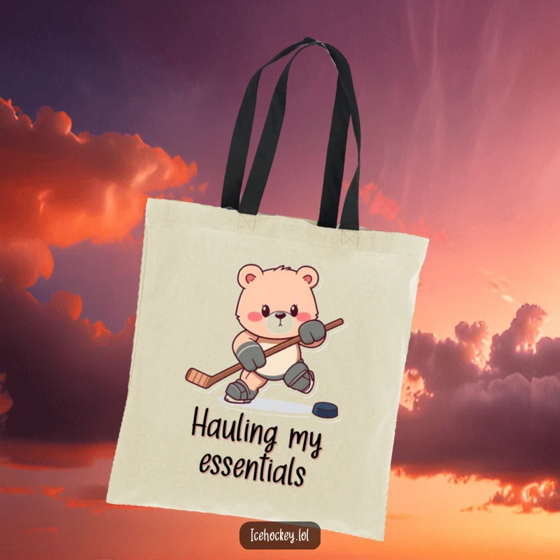 Funny tote bag: A determined bear charges forward with a hockey stick and puck, ready for any adventure.