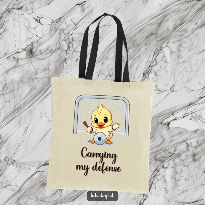 Funny tote bag featuring a determined little duck making a goalie save, eyes wide with humorous, concentrated effort.